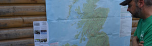 Man looking at Ultimate UK Cycle Planner (cycling map) 