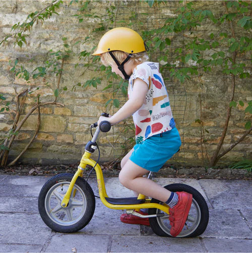 Child wearing yellow helmet 