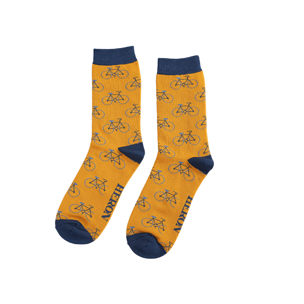 Mr Heron mustard socks featuring a repeating bike pattern