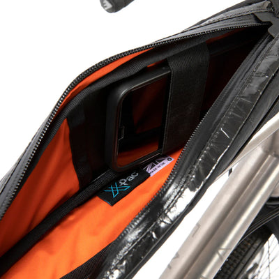 Inside Restrap top frame bag. Orange inner. 
