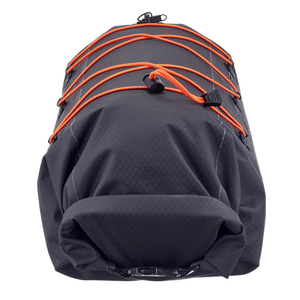 Black dry pack with orange straps for securing items to the bag.