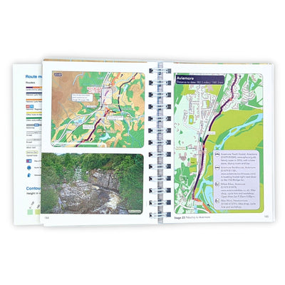 Guidebook laying open flat, showing a full-colour map and a photograph of a river surrounded by trees.